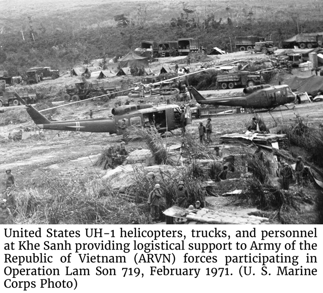 United States UH-1 helicopters, trucks, and personnel at Khe Sanh providing logistical support to Army of the Republic of Vietnam (ARVN) forces 
