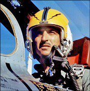 Major Robert Francis Ronca seated in an F-100 in 1964. In an Associated Press interview, he once described his job as a jet fighter pilot as "flying  nosebone to nosebone with the guy on the ground to see who gets who." (courtesy of Super Sabre Society)