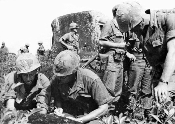 Marine commanders confer just before entering the Phuoc Valley during Operation HARVEST MOON, circa December 9, 1965.