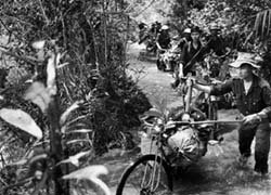North Vietnamese Personnel Moving Supplies
