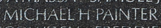 Engraving on The Wall of the name of Petty Officer First Class Michael H. Painter, U.S. Coast Guard