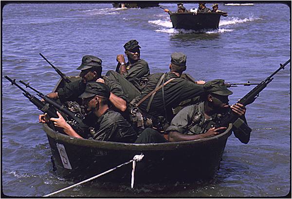 U.S. Marines in outboard motor boats approach their landing site in the Rung Sat Special Zone during Operation JACKSTAY, March 26, 1966. (National Archives)