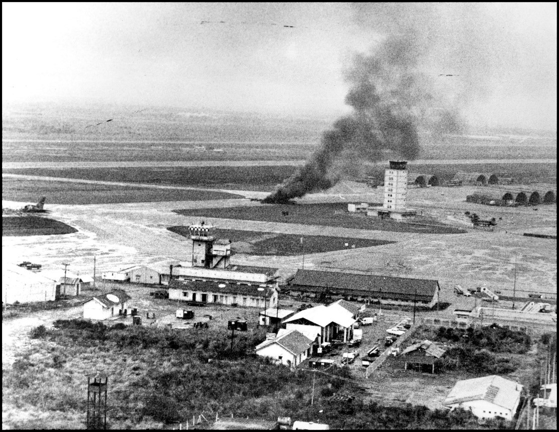An aircraft burns on the runway at Tan Son Nhut Air Base after being hit by North Vietnamese artillery fire, April 29, 1975. 