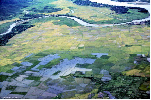 Northeasterly aerial view of the Thuong Duc Special Forces Camp airstrip at the base of the western end of Charlie Ridge with a USAF C-7 Caribou on the runway (upper right). (Ron Lester photo)