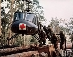 Members of the 173d Airborne Brigade load casualties aboard a UH-1 during the battle of Đăk Tô, November 22, 1967. (U.S. Army)
