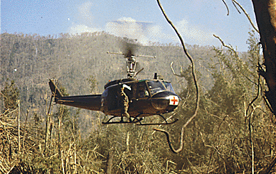 A UH-1D medevac helicopter takes off to pick up a wounded soldier near the Demilitarized Zone, October 16, 1969. (National Archives)